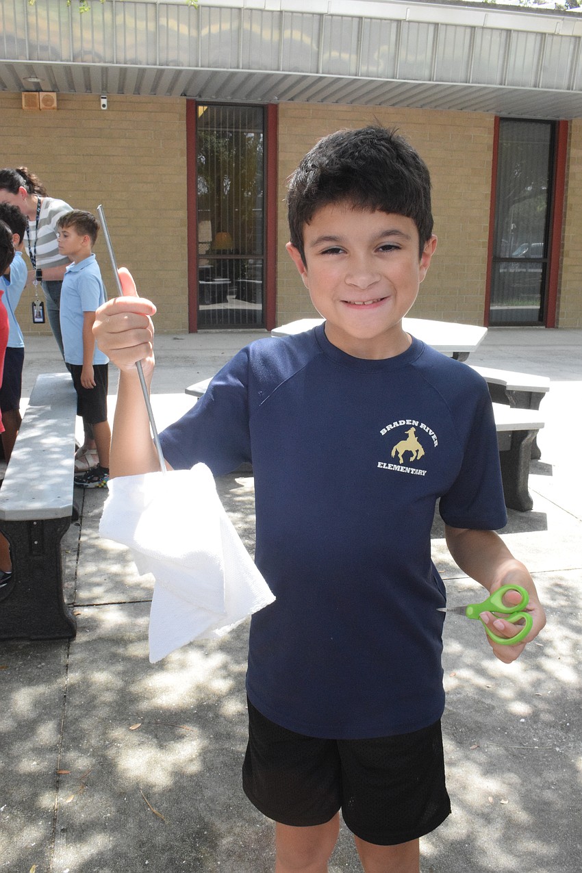 Third grader Mason Stephan shows off the oyster rag pot he created. Braden River Elementary School is creating 500 oyster rag pots, which will help filtrate up to 1,250,000 gallons of water.