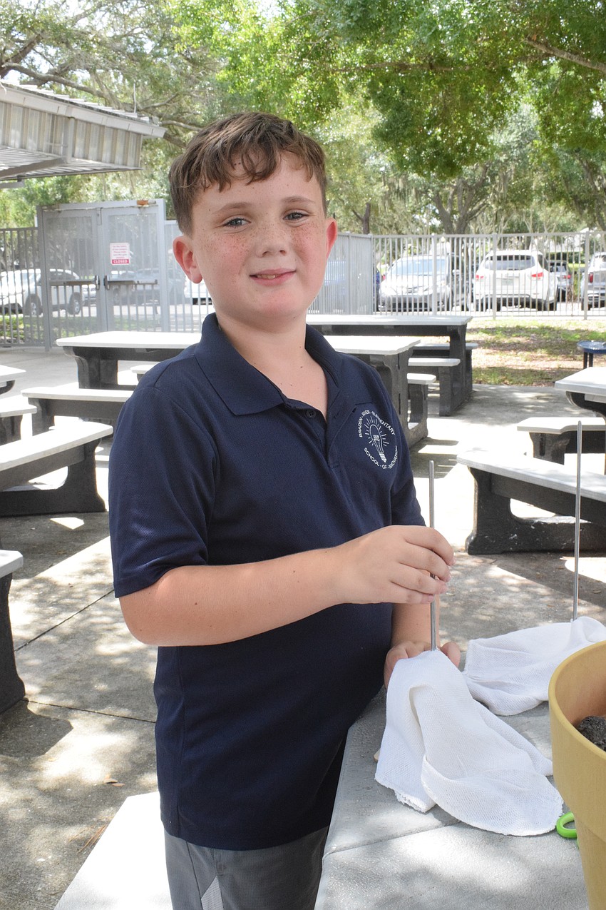 Third grader Ethan Boardman finishes another oyster rag pot.