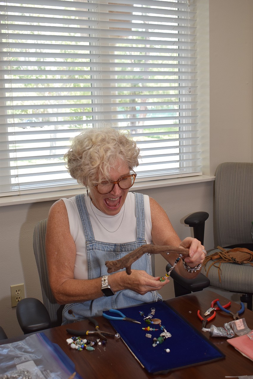 Donna Powell planned out the items used for her suncatcher before making it at the Paradise Center.