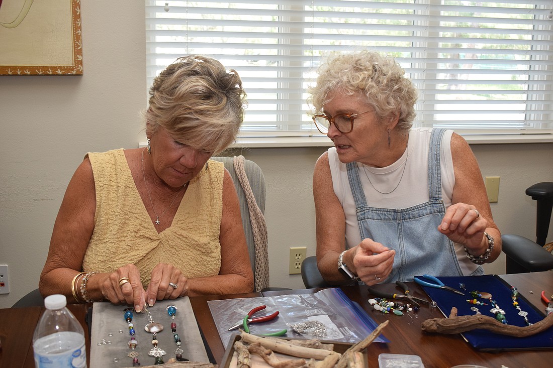 Sallie West joined her close friend Donna Powell in making suncatchers at the Paradise Center.