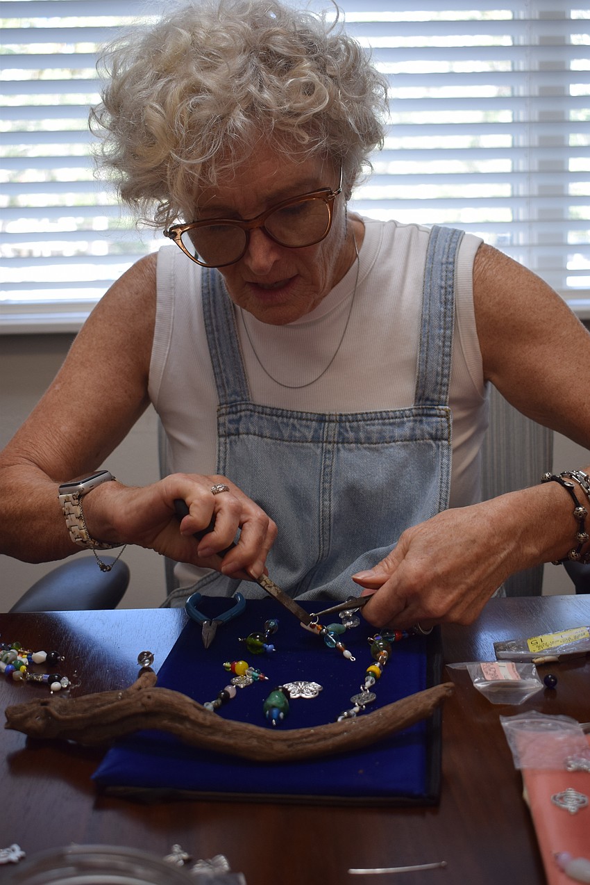 Donna Powell making a suncatcher at the Paradise Center.