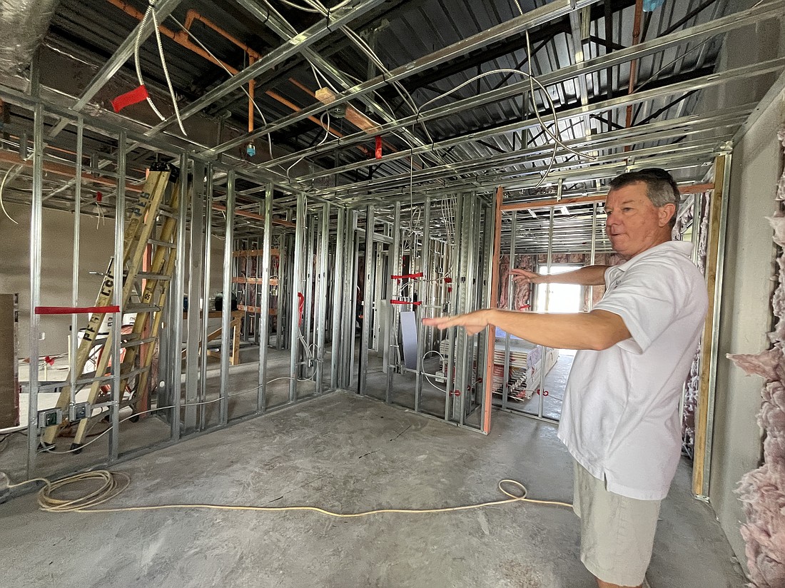 Rob Oglesby, the development director for Nate's Honor Animal Rescue, shows the apartment above the welcome and adoption center where veterinary externs will be staying.