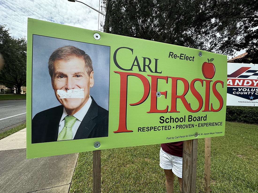 Carl Persis' political sign was damaged by a sticker last week. Courtesy photo