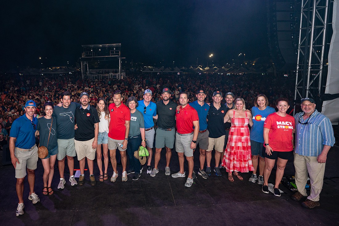 The board of HopeWill Foundation poses at Pig Jig.