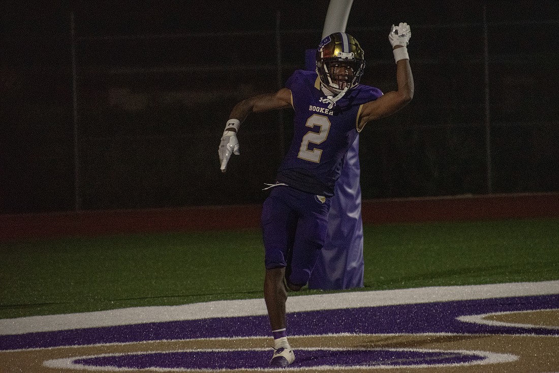 Booker junior wide receiver Tyren Wortham celebrates catching a 60-yard touchdown pass from junior quarterback Joel Morris against Carrollwood Day.