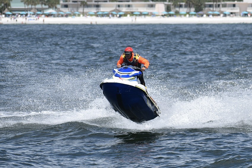 A P1 offshore staff member heads across the waves.