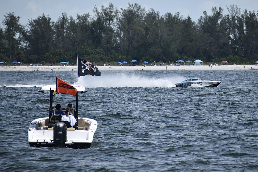 El Bandidio Tequila / Sunprint of New Port Richey, Florida with Steven Fehrmann and Steve Miklos, passes by a boat of P1 Offshore staff.