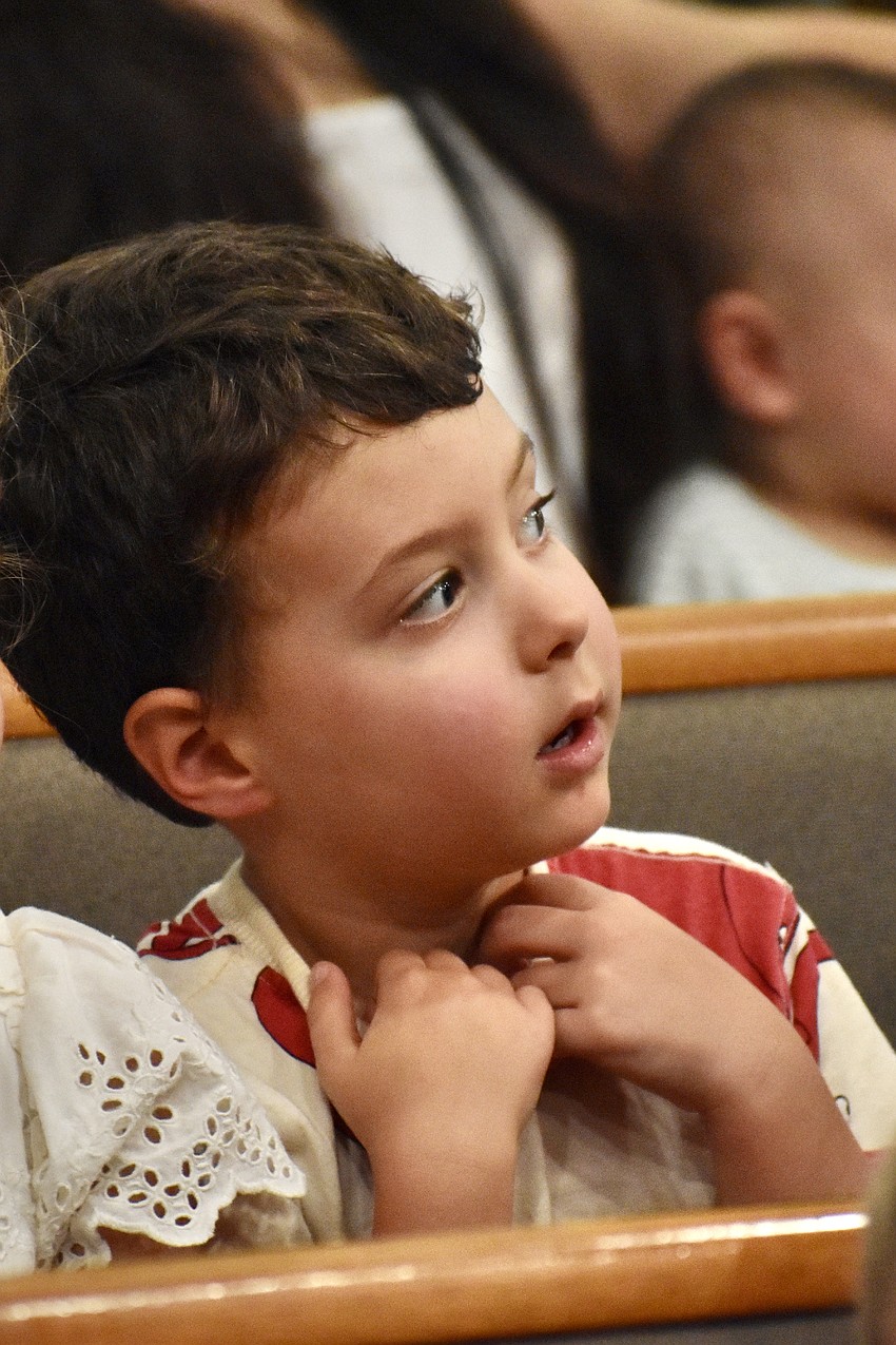 Noah Goodrich, 4, listens as Rabbi Michael Shefrin discusses Rosh Hashana.