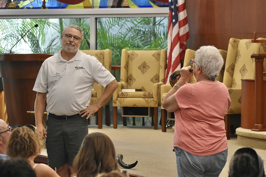 Rabbi Michael Shefrin pauses so that his mother, Rabbi Mimi Weisel, can take a turn blowing the shofar.