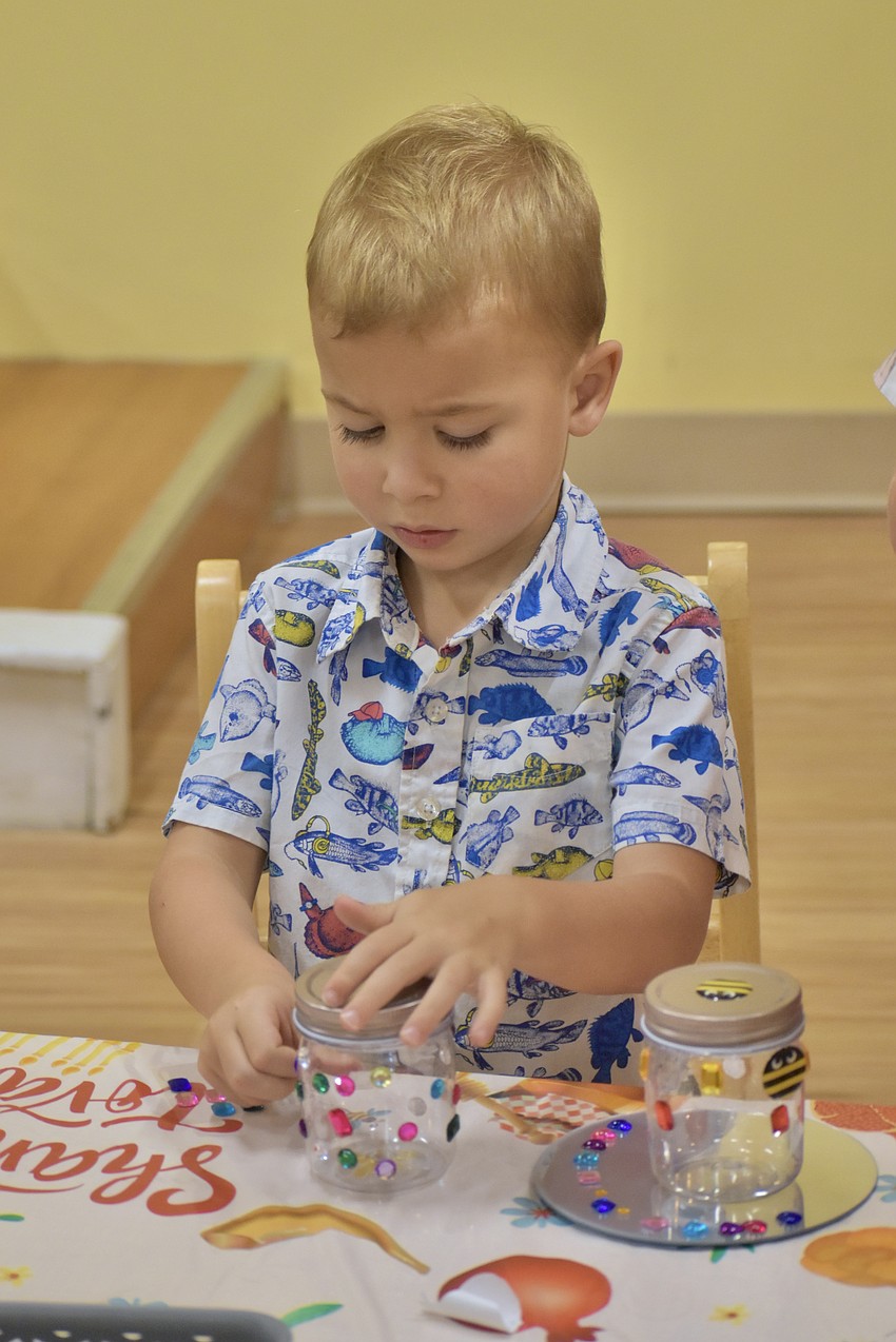 Eli Daniel, 5, works on a craft.