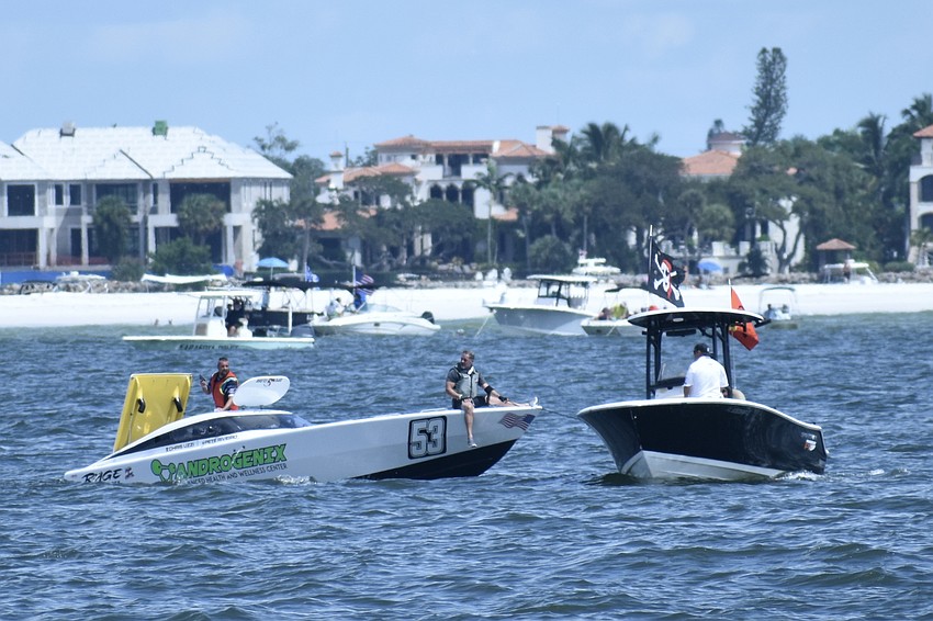 Androgenix Advanced Health and Wellness Center of North Palm Beach, Florida, with Chris Uzzolina and Pete Riveiro, prepares to be towed to shore, after experiencing a wipeout.