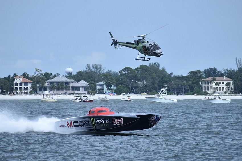 Monster Energy / M CON of Wathena, Kansas with Myrick Coil and Tyler Miller, speeds along the course as a helicopter makes a pass.