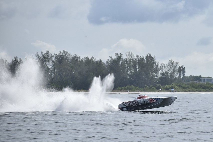 Team Defalco of Bronx, New York, with Billy Moore and Mike Falco, speeds by the shores of Lido Beach.