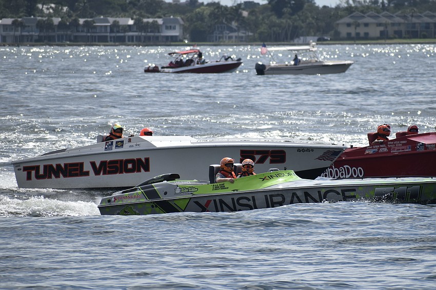 TunnelVision of Pasadena, Maryland with Michael Mccolgan and Rob Bryant; XINSURANCE of Niles, Michigan with Brit Lilly and Randy Kent; and YabbaDabbaDoo of Reddick, Florida with JD Ivines and Steve Adams line up at the start of a race.
