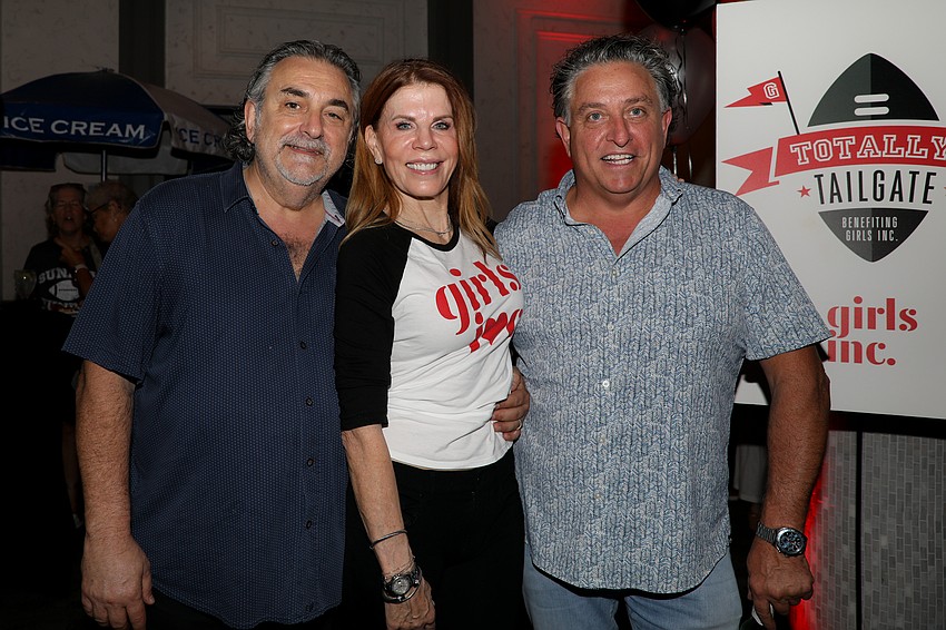 Phil Mancini of Michael's On East, with co-chairs Renee Phinney and Glen Reith.