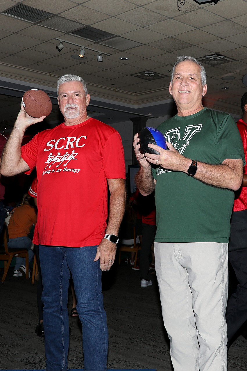 No one can resist taking a shot at the quarterback toss carnival game, and both Tom Edwards and husband Nick Ciallelo easily scored during Totally Tailgate.