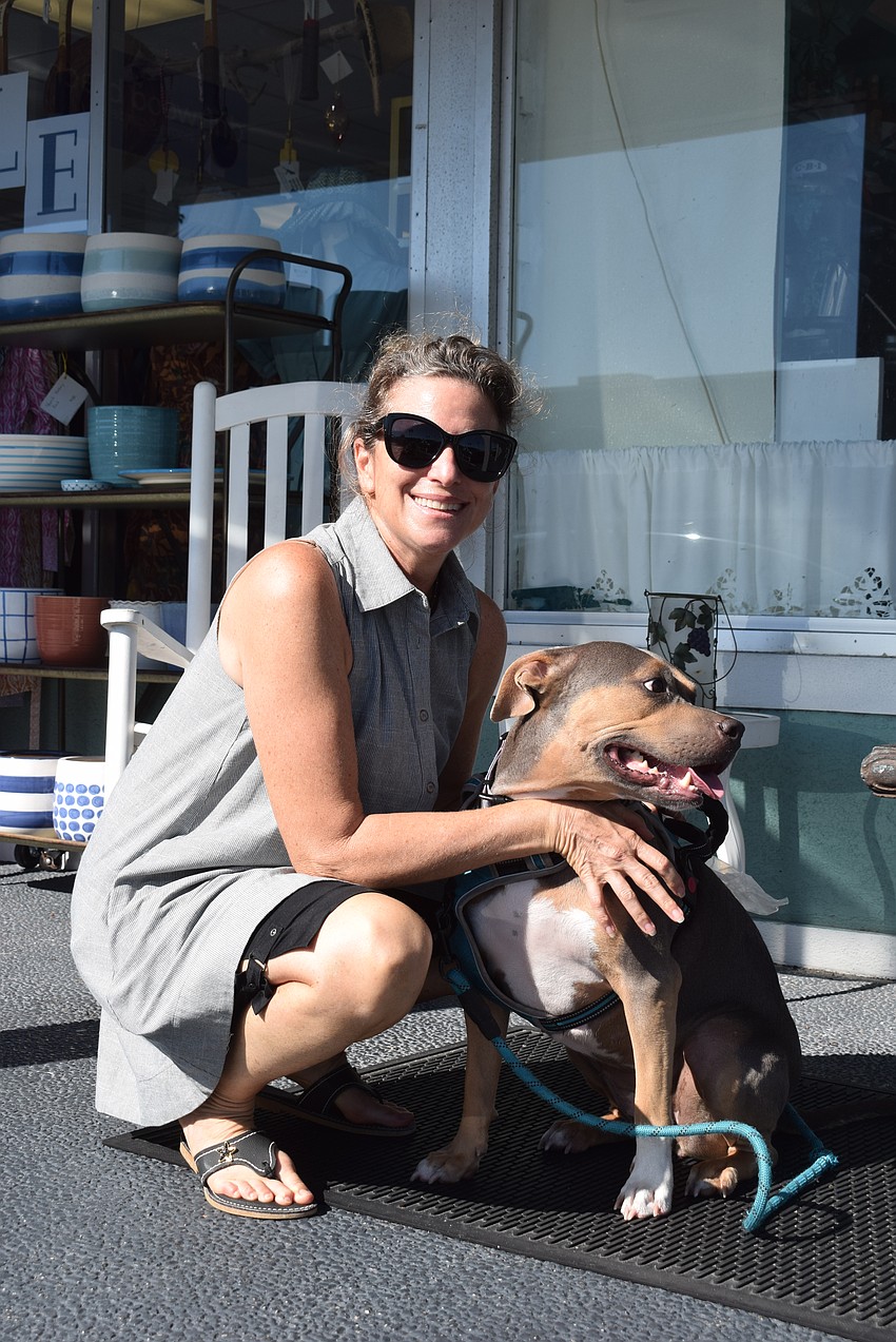 Suzy Brenner with her new dog Skylar at Summer Night Out in Whitney Plaza.