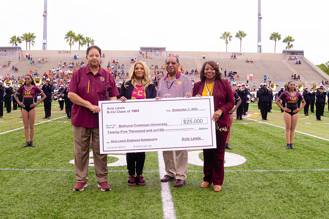 Avis Lewis presents the B-CU Administration with a donation. Courtesy photo