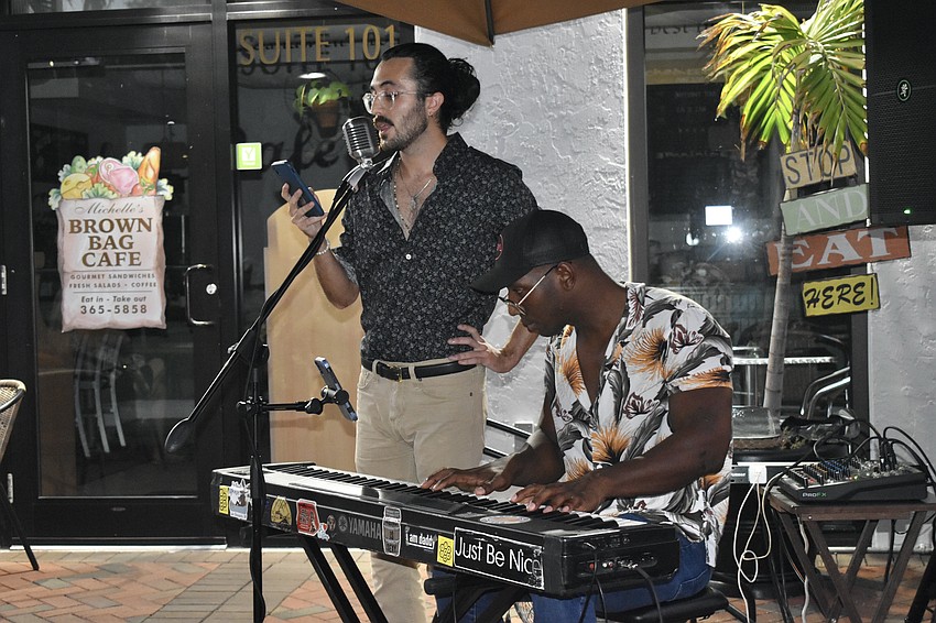 Unwind Massage and Wellness owner Heather Welch's son Gabriel Welch sings with Ben Jacobs, known as Babyl.