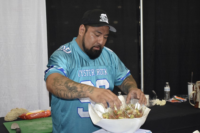 Jose Suarez, kitchen manager at Anna Maria Oyster Bar in UTC, sets out ceviche samples.