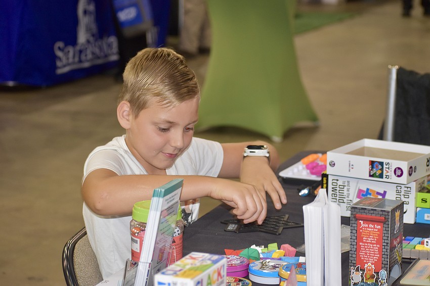 Maximus Latokhin, 9, performed all of the activities at the table of Kid Potential Sarasota.