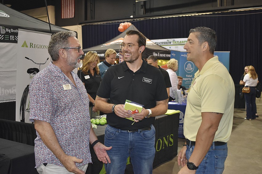 Greg Courter of Horizon Insurance, Justin Bellante of Titan Placement Group and Eric Konovalov of Lakewood Ranch Business Alliance enjoy a conversation.