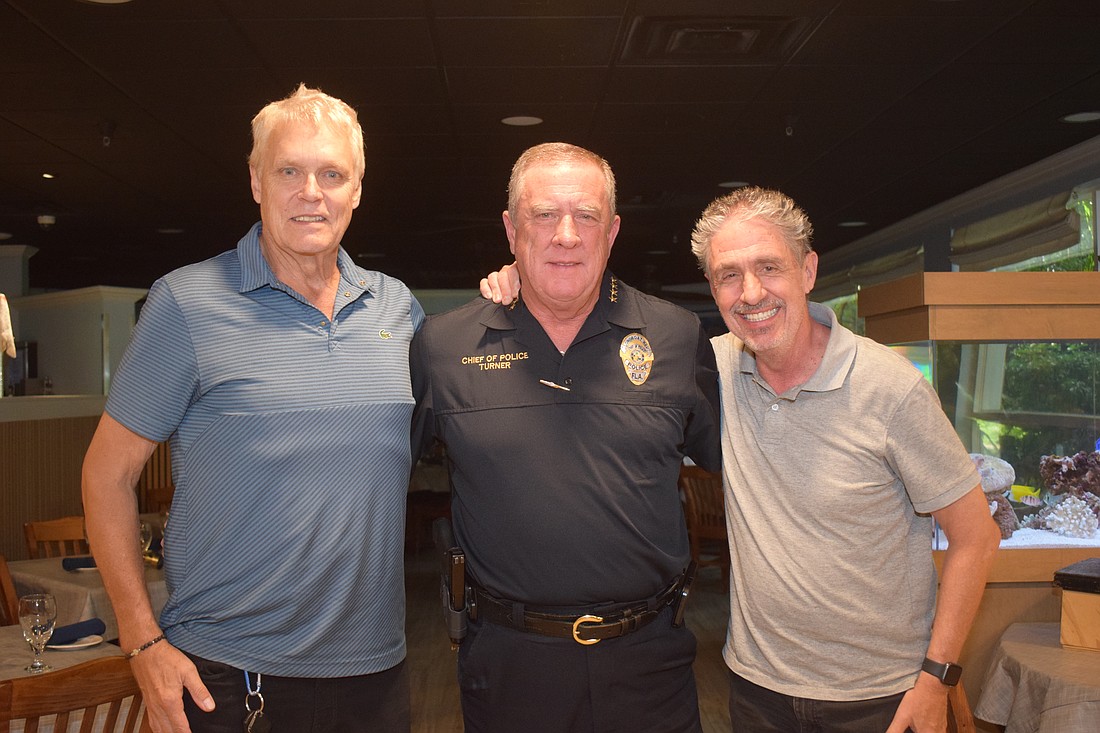 Chris Sachs, Police Chef George Turner and Micahel Garey at the Kiwanis Club meeting.