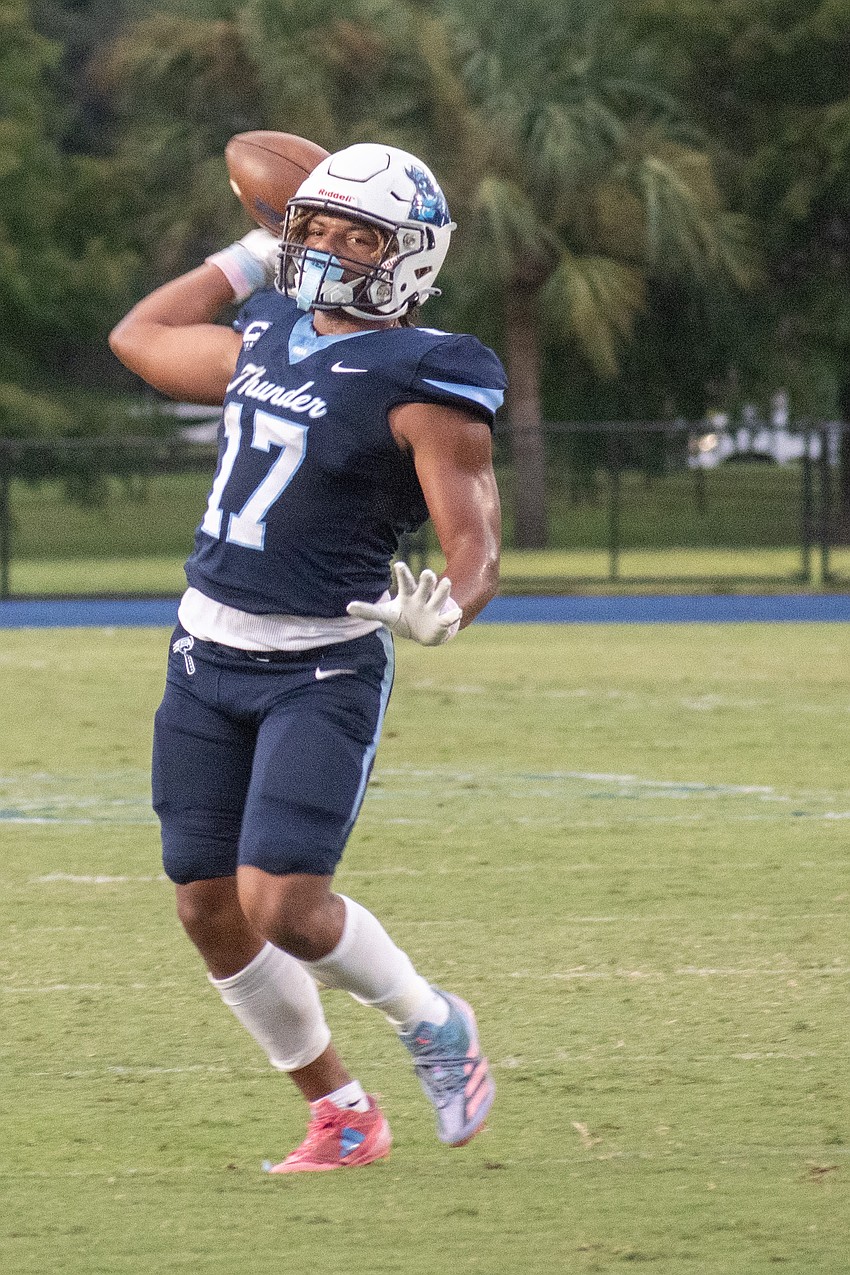 ODA junior running back Allen Clark tosses a pass to senior receiver/defensive back Carson Fisher in the end zone against Sarasota Christian.