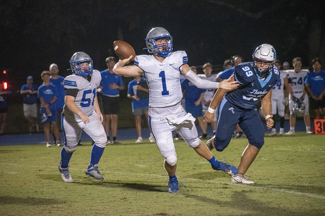 Sarasota Christian quarterback Ben Milliken fires a pass against ODA. Milliken threw four touchdowns in the game.