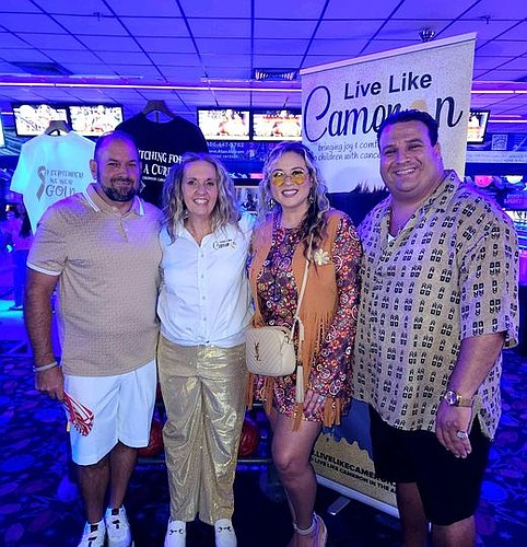 Mark and Theresa Mistie with Live Like Cameron founders Dan and Melisa Fulling at the Let's Boogie For a Cure '70s Disco Party at Palm Coast Lanes. Courtesy photo