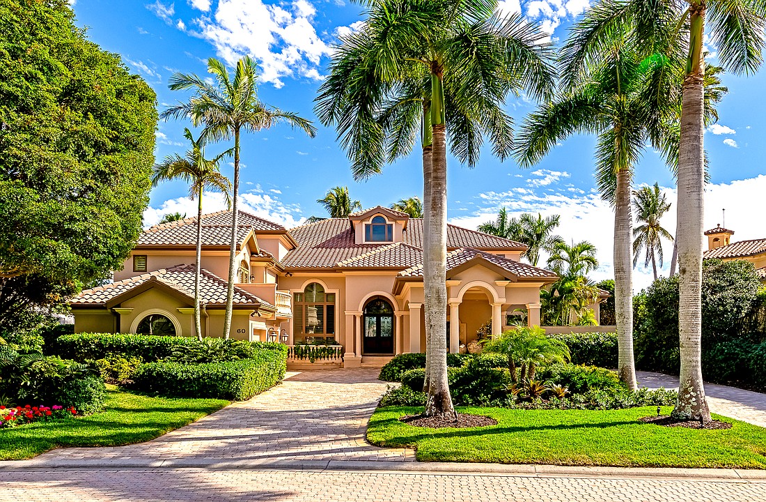 The home at 60 Lighthouse Point Drive has four bedrooms, four-and-a-half baths, a pool and 7,170 square feet of living area.