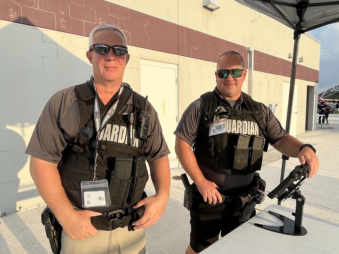 Guardians John Bartley and Joe Hodge man the security screeners at Braden River High School's football game Sept. 20.