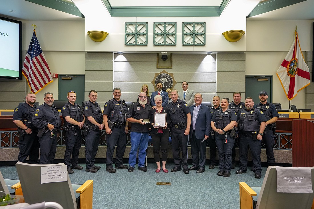 Evelyn Rebostini is recognized by the city with a mayor's proclamation and a key to the city. Photo courtesy of Pauline Dulang/Ormond Beach Police Department