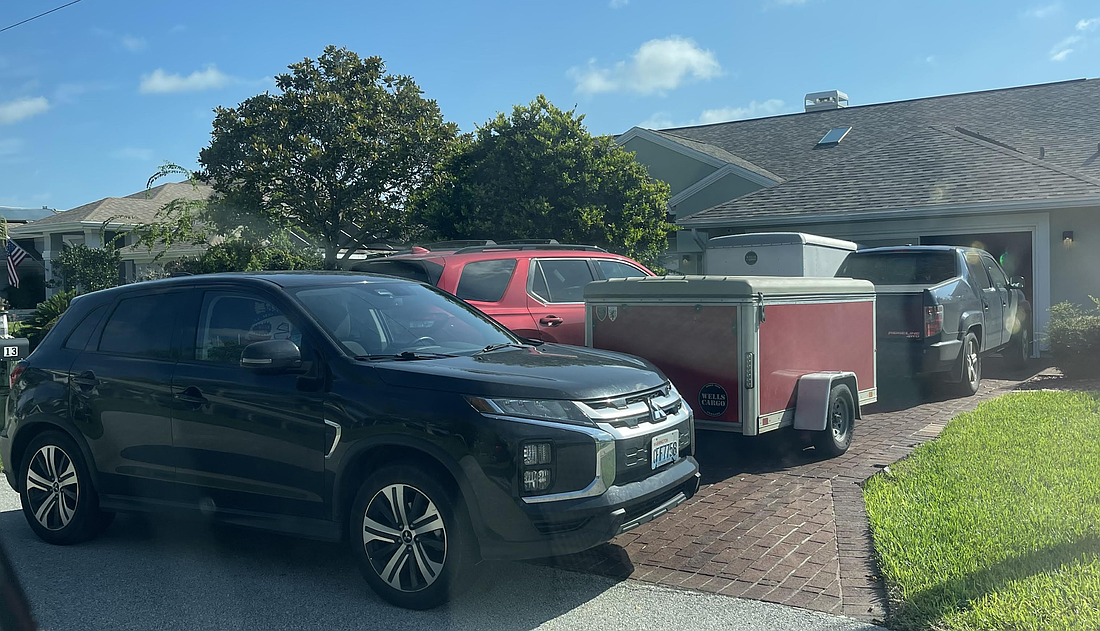 Vacation renters often bring multiple vehicles with trailers or boats attached, taking up the streets' limited parking. Courtesy of the Canal Community Coalition