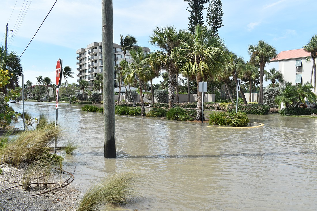 Beach Road, beside Siesta Key Beach, is flooded.