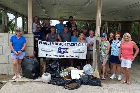 Flagler Beach Yacht Club members with their collection of debris after their canal and Intracoastal Waterway cleanup. Courtesy photo