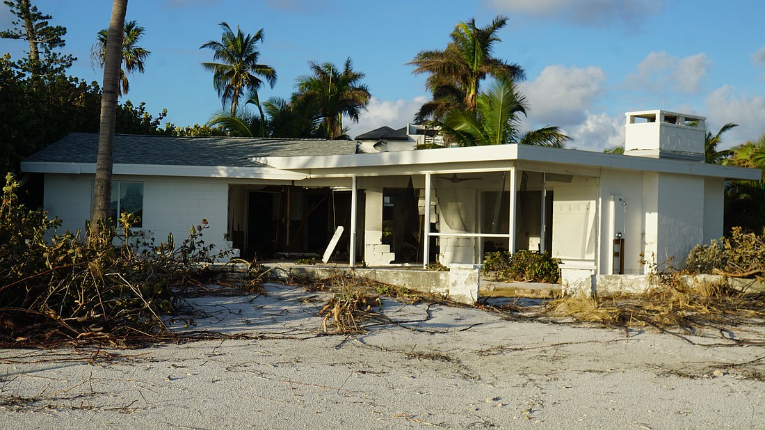 A beachfront house badly damaged by Hurricane Helene's storm surge.