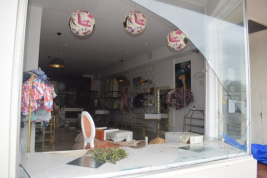 Charleston Shoe Company's window was broken after Hurricane Helene.