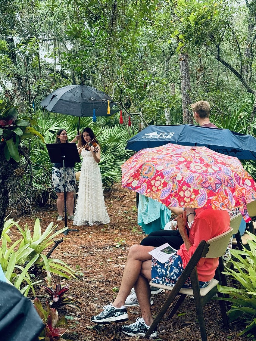 Parrish High School student Skylar Jandula plays the violin at the start of the dedication.