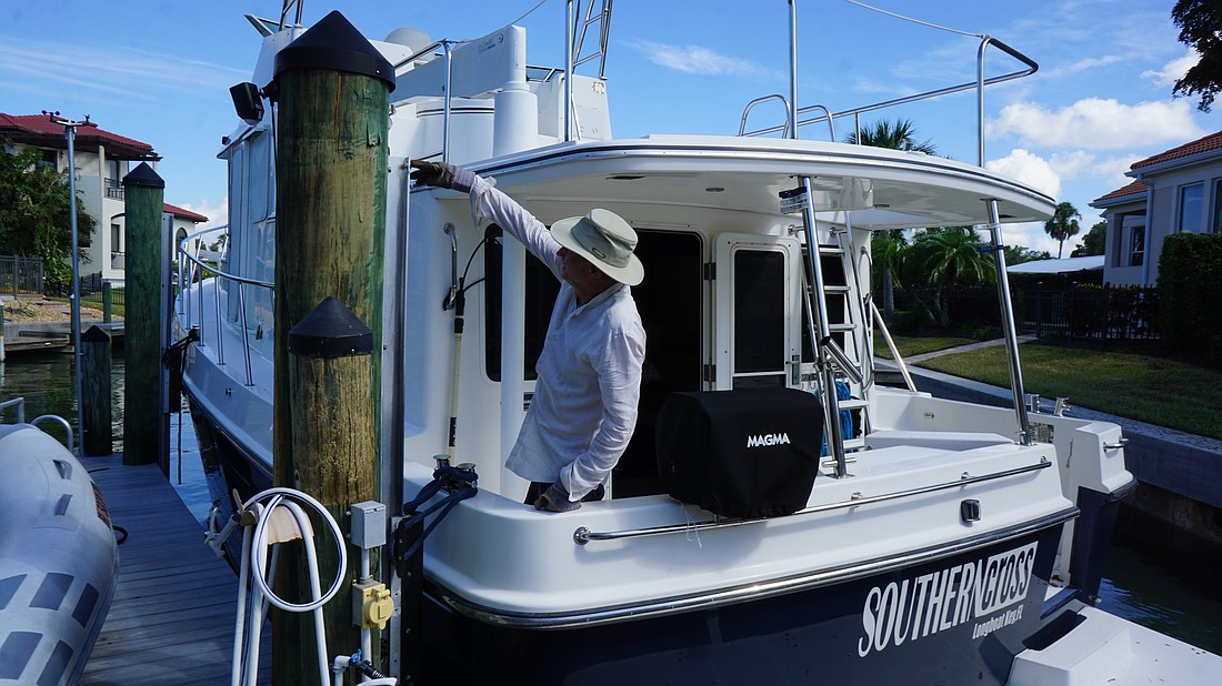 Gary Coffin points to where his boat was floating during the peak of Hurricane Helene's storm surge.