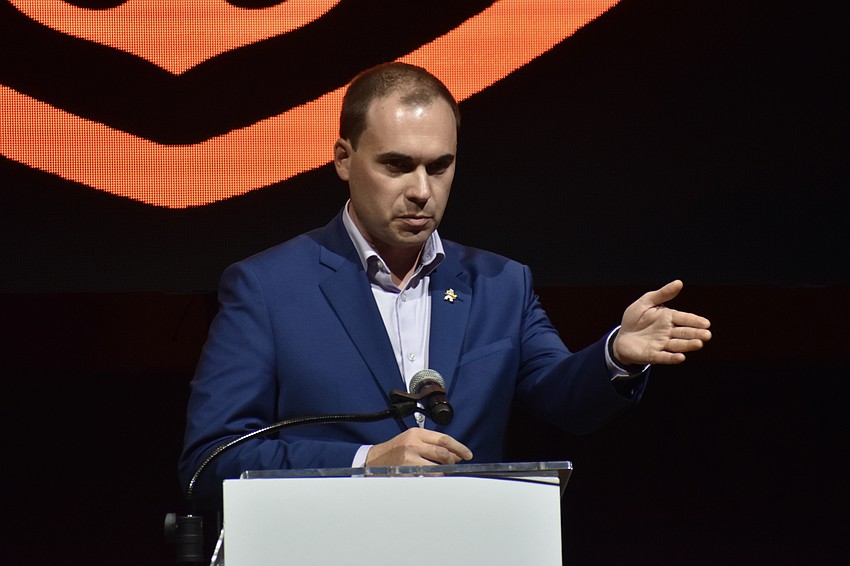 Sarasota High School principal Ryan Chase offers a speech.