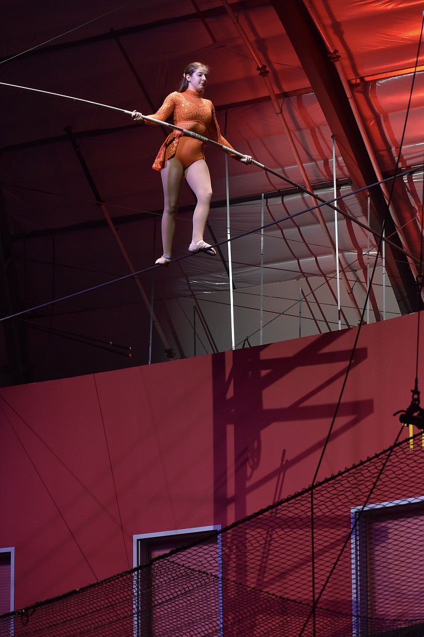 Sarasota High School senior Charity Overholt shows her skills on the tightrope during a student performance as the event begins.