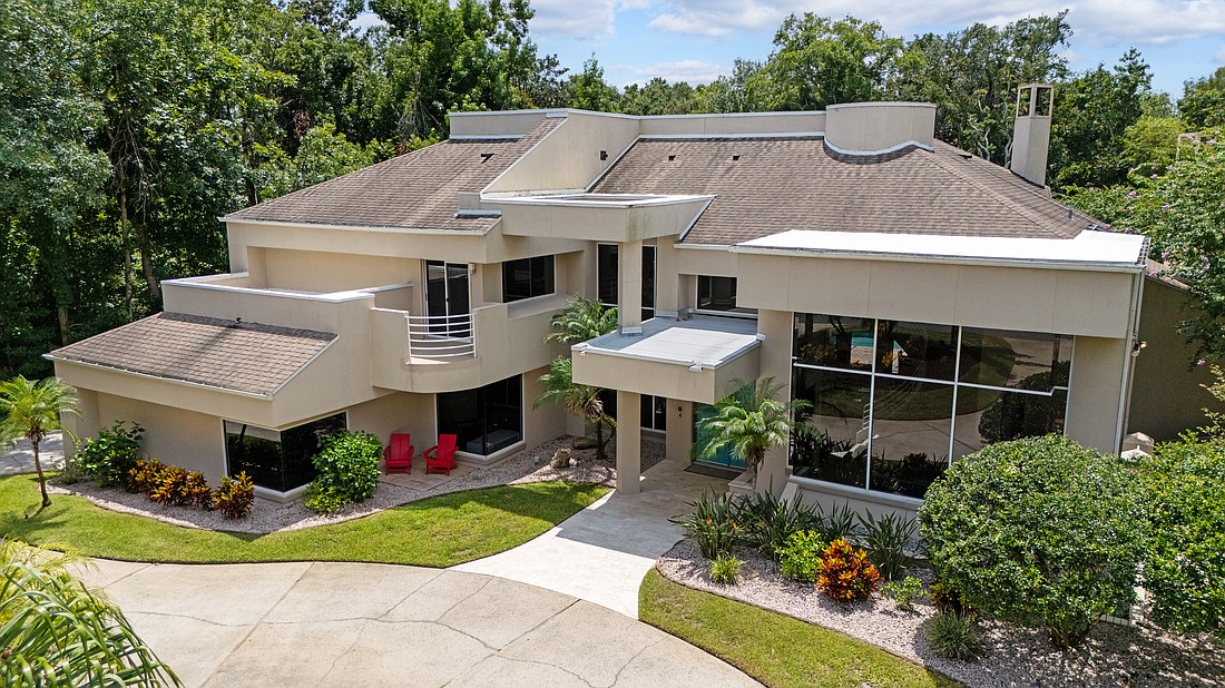 The house is a 5/4.5 and has two fireplaces, a pool, spa, dock, boat house and 5,133 square feet. Photo courtesy of Hilary Deininger/HD Homes Group