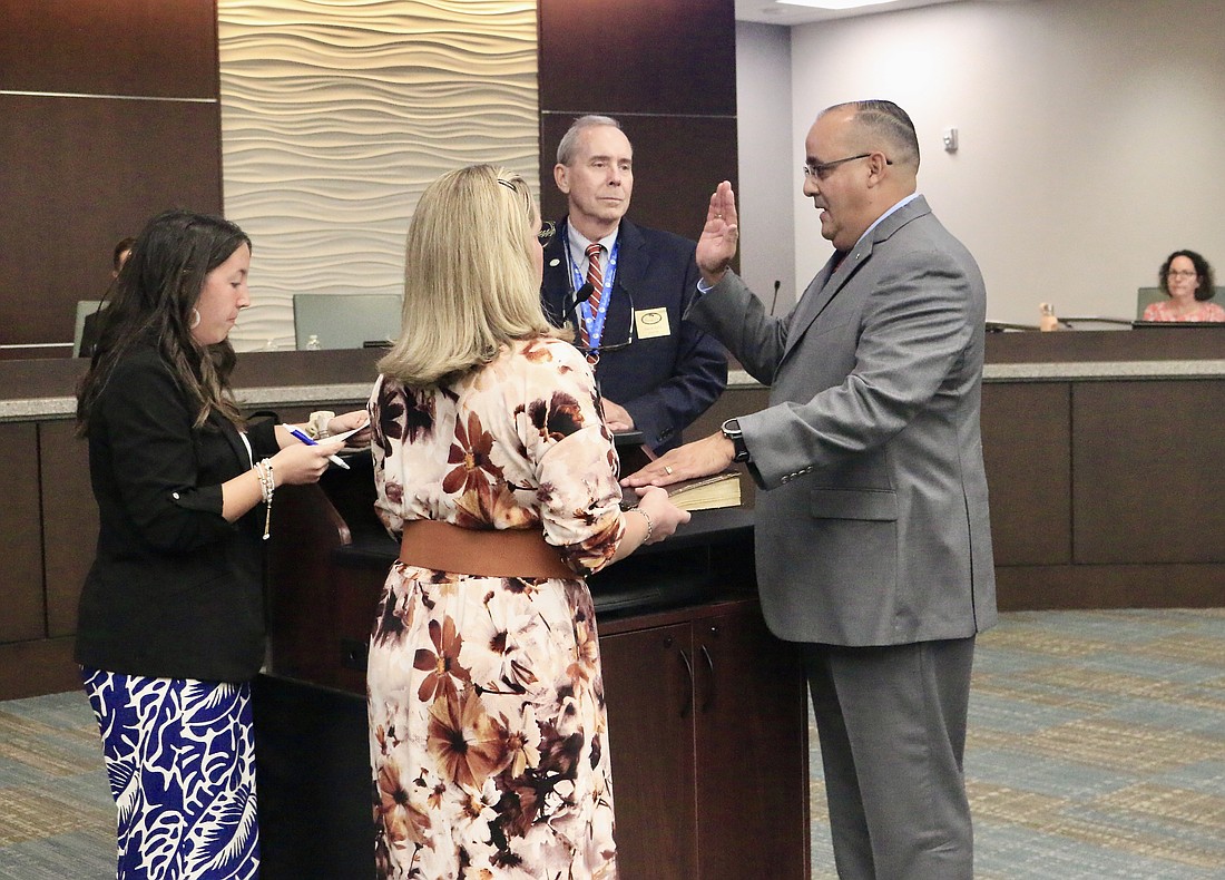 U.S. Army Reserve Brig. Gen. Charles Gambaro Jr. is sworn in as the District 4 representative by City Clerk Kaley Cook. Photo by Sierra Williams