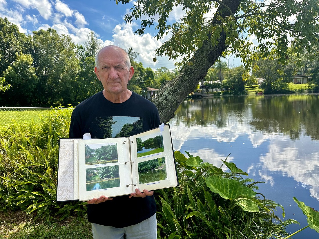 Dr. Phillips resident Norman Watkins in front of Lake Odell in his backyard.