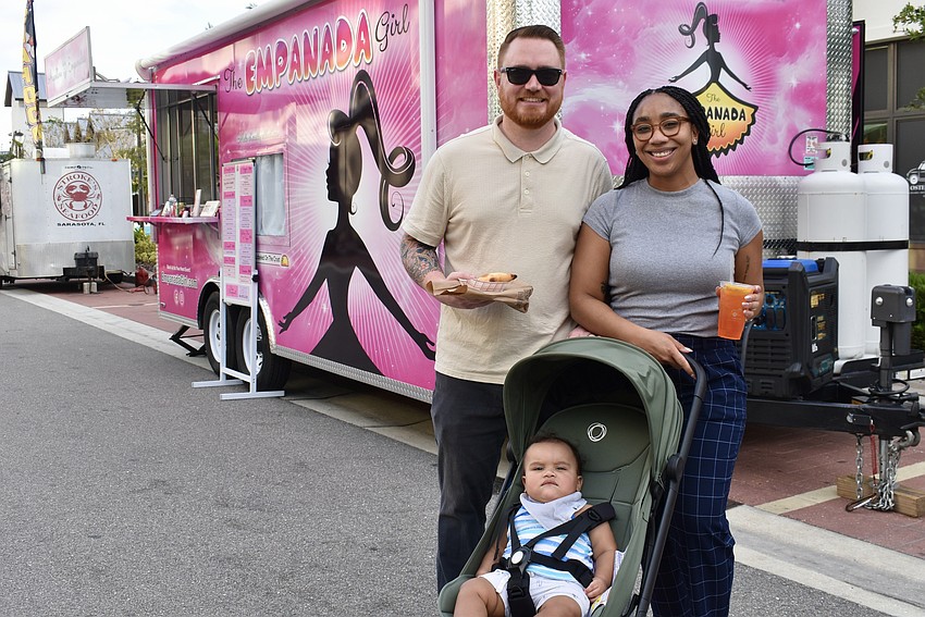 The Empanada Girl truck is only the first stop for Sarasota's Brandon, 9-month-old Remington and Tianna Porter. Next up are the Big Blue Grilled Cheese Company and the Island Fin Poke Company trucks.