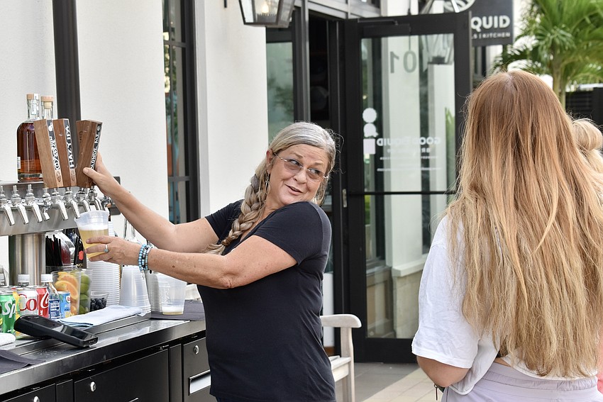 Shari Carpenter tends bar outside for Good Liquid Brewing Company on Oct. 2 for Ranch Nite Wednesday.