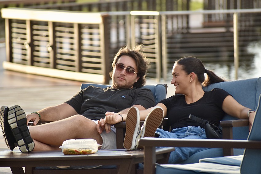 Lakewood Ranch residents Carly Palkovich and Dino Alazo relax near the pavilion.