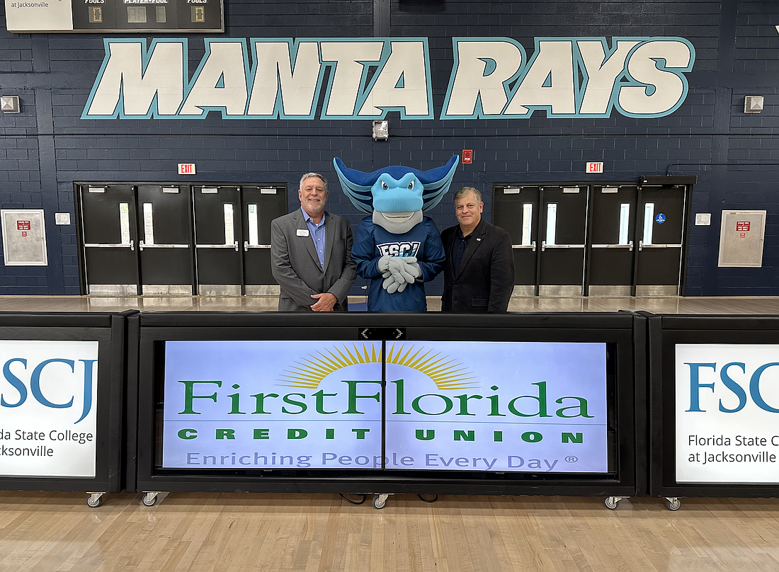 First Florida Credit Union President and CEO Brent Lister, left, and Florida State College at Jacksonville President and CEO John Avendano with FSCJ’s new manta ray mascot. The credit union is sponsoring all of the college’s athletic teams.