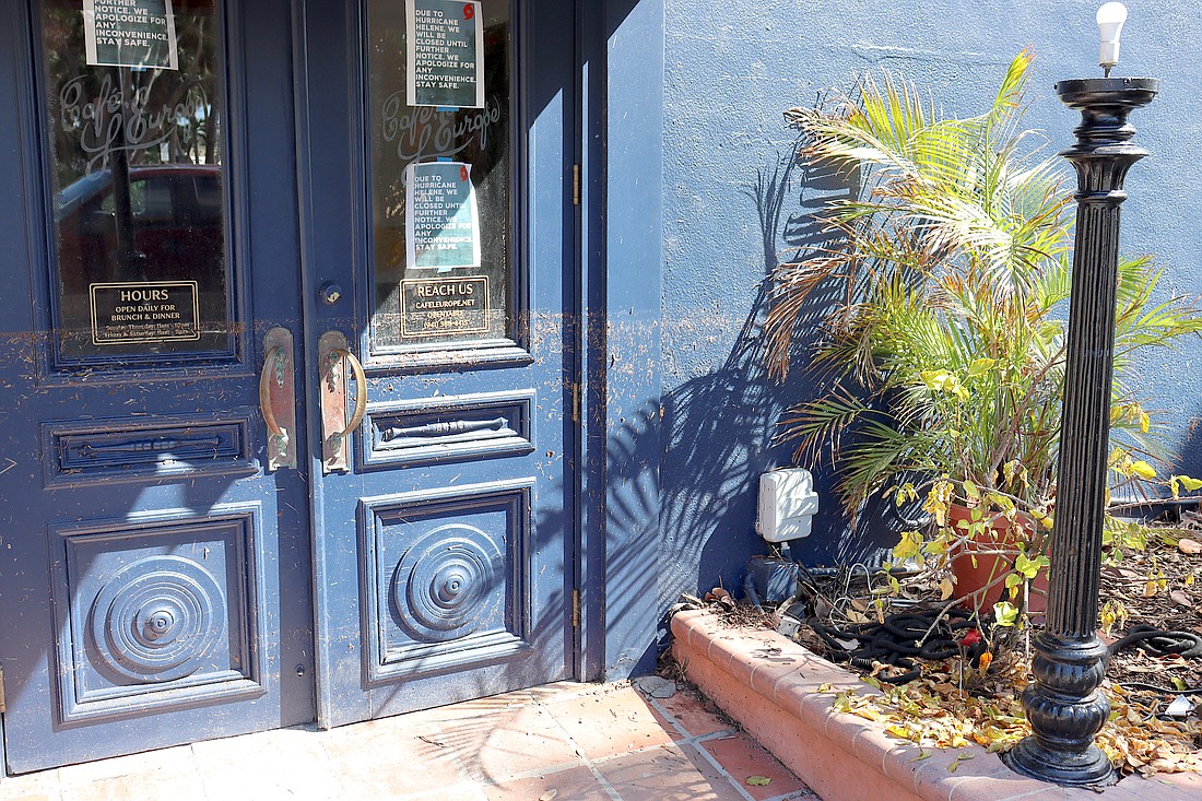 The wall and door at Café L'Europe shows the high water mark of the Hurricane Helene storm surge on St. Armands Circle.